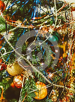 Blurred Christmas background with Christmas tree, decorations and tinsel