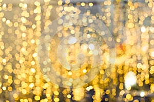 Blurred of Christmas light gold bokeh for backdrop design