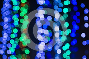 Blurred Christmas lights abstract background. Winter holiday design with bokeh