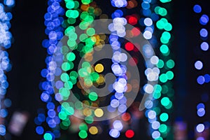 Blurred Christmas lights abstract background. Winter holiday design with bokeh