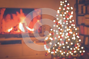 Blurred Christmas room with tree and bokeh lighting. Christmas concept and background