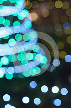 Blurred christmas tree lights in vertical frame