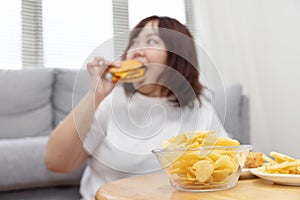 Blurred Chubby Woman Enjoy Eatting Beef Cheese Burger