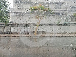 Blurred cityscape in raining, In car view