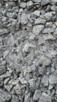 Blurred close up top view of crushed stone pattern for background or wallpaper.