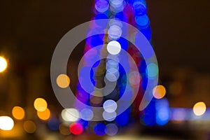 Blurred colored circles on a light holiday background