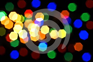 Blurred colorful lights over black