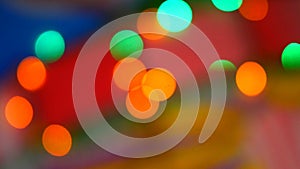 Blurred colorful lights. Red, green, yellow, orange, blue defocused glittering bokeh festive background.