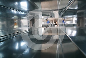 Blurred Construction Worker Through Air Duct