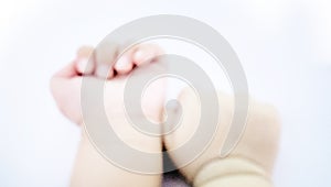 Blurred cute baby hands background
