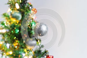 Blurred Defocus Bokeh of Christmas tree. Christmas decoration background with copy space