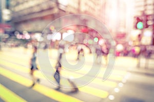 Blurred defocused abstract background of people walking on street