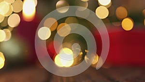 blurred defocused red golden, green Christmas background, blinking lights gift