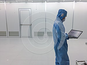 Blurred engineer Inside Clean room class 1000 with emergency door at factory,empty room