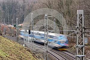 Blurred fast driving Czech train with railroad using motion blur effect