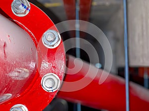 Blurred Fire pump system with big red pipe line system background