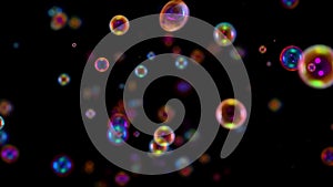 Blurred footage of beautiful colorful rainbow soap bubbles flying in the air against a black background. A lot of