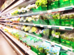 Blurred fresh fruits and vegetables at retail store. Abstract background of supermarket. Grocery market blurred background. Fruits