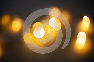 Blurred garland light. Golden bokeh on black background,blurred garland light