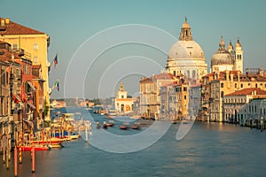 Blurred Gondole in grand canal at golden sunrise, Ethereal Venice, Italy