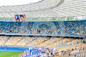 Blurred grand soccer arena or stadium with stands and spectators. 2016 sport background