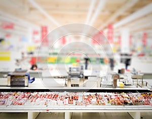 Blurred grocery store with isolated ham and sausage