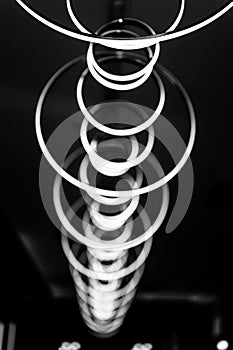 blurred hanging lamp bulb in the form of rings. blur abstract lighting modern pendant electricity round lamps chandelier glowing g