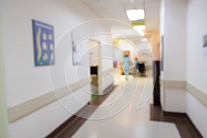 Blurred hospital indoor corridor hallway as background for graphic pursuit