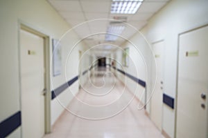 Blurred hospital indoor corridor hallway as background for graphic pursuit