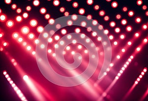 Blurred image background of red stage lights. Party