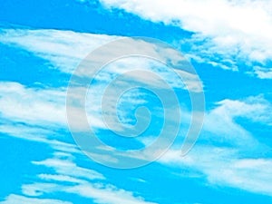 blurred image of blue sky, white clouds, blue background