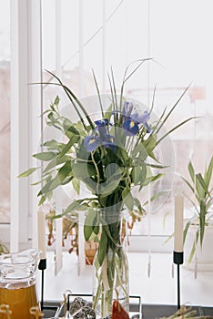 Blurred image of bouquet of fresh tulips in flower shop. Spring floral tulip bunch