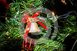 Blurred image of Christmas Decorations In Christmas Tree with copy space of blur light boken and people background. vintage tone