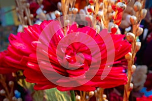 Blurred image, colorful artificial flowers made out of colored sola, spongewood, handicrafts on display during the Handicraft