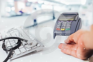 Blurred image of counter services in hospitals and paying with a credit card and using a terminal