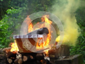 Blurred image of cremate death people on fire flame burning, fire in fireplace, The funeral of Thailand,