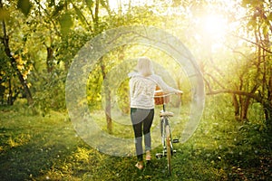 Blurred image of female with bicycle