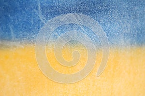 Blurred image Flag of Ukraine, Hoarfrost on glass, frost, cold. Yellow-blue background.  Symbol, poster, banner of the national fl