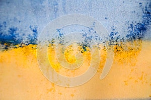 Blurred image Flag of Ukraine, Hoarfrost on glass, frost, cold. Yellow-blue background.  Symbol, poster, banner of the national fl