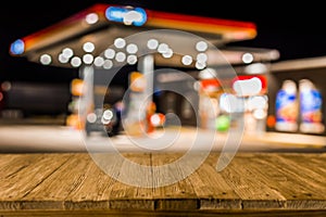 Blurred image of gas station in Lithuania at night. Defocused ga