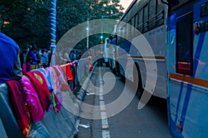 Blurred image, Kolkata, West Bengal, India. Colourful warm winter clothes are being sold at Gangasagar transit camp, Babughat, photo