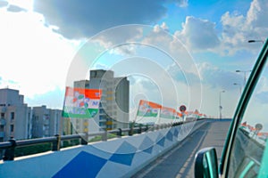 Blurred image, Kolkata, West Bengal, India. Kolkata cityscape , Trinamool Congress flags waving in air on Maa flyover, Kolkata.