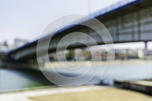 Blurred image of modern city bridge over the river of danube in belgrade serbia brankov bridge blur shot from left bank of river