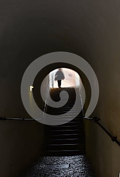 Blurred image. An old abandoned haunted house. Black silhouette on a background of a window. Halloween horror concept.