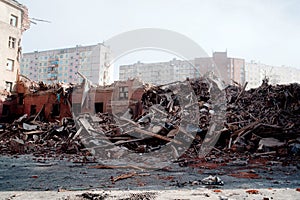 Blurred image Pile of demolition rubble. Gray rubble at a building site. Demolition of a house. Concrete rubble debris on