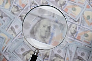 us dollar bill through magnifying lens checking banknotes