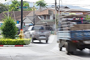 Blurred image of vehicles running on street in Thailand (motion