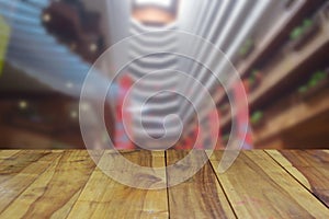 blurred image wood table and abstract interior hotel lobby background.