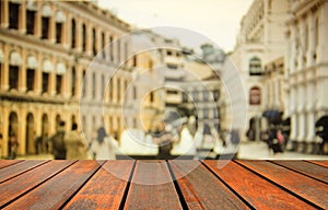 Blurred image wood table and people crowd walking on busy street