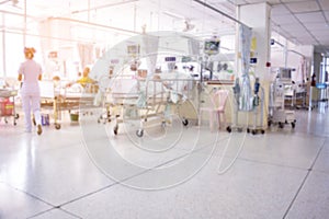 Blurred images of ICU rooms with many patients